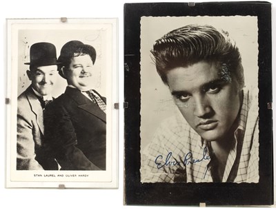 Lot 10 - A signed black and white postcard of Laurel...