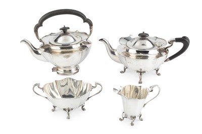 Lot An Edwardian silver four piece tea service, of...