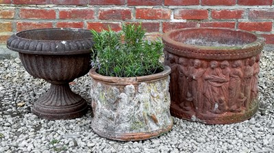 Lot 1356 - A cast iron urn and two cylindrical terracotta planters