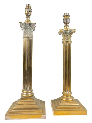 Lot 409 - Two similar brass table lamps