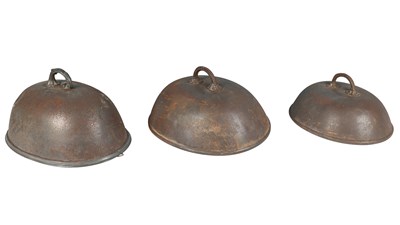 Lot 1144 - A group of three steel and pewter mounted oval meat covers