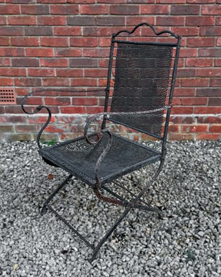 Lot 1380 - An antique, possibly French, wrought iron folding armchair