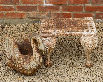 Lot 1499 - A cast iron swan planter and a trivet