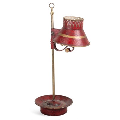 Lot 1182 - A Continental red toleware student's candle lamp