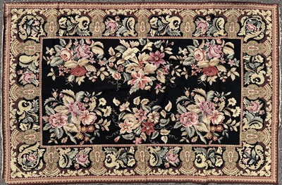 Lot 1269 - An early 20th century English needlepoint carpet