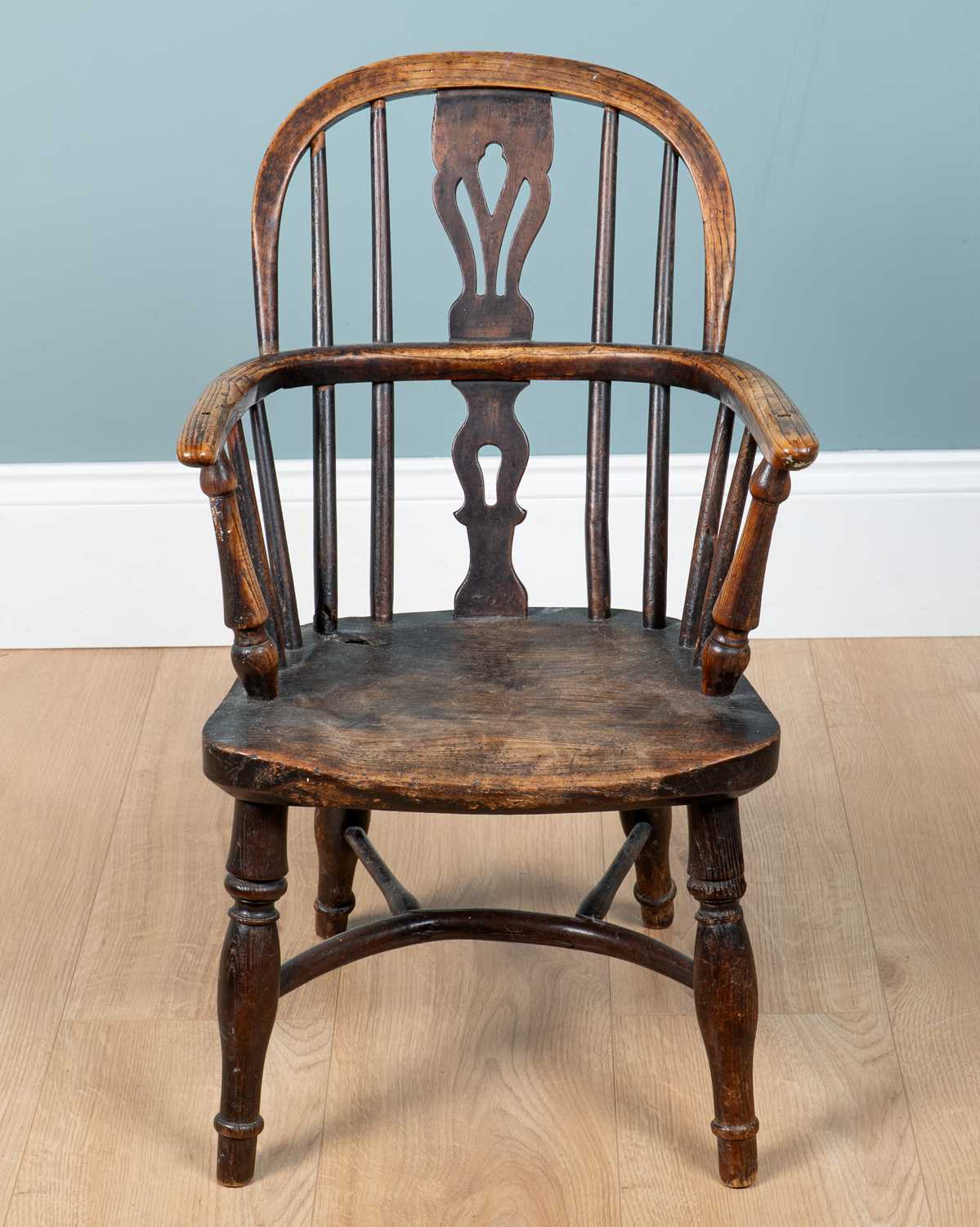 Lot 1146 - An antique child's Windsor armchair