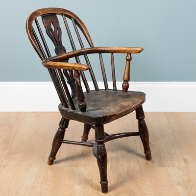 Lot 1146 - An antique child's Windsor armchair