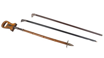 Lot 1001 - Two silver topped walking canes together with a shooting stick