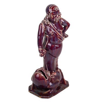 Lot 237 - Sang de boeuf model of a figure on a toad...
