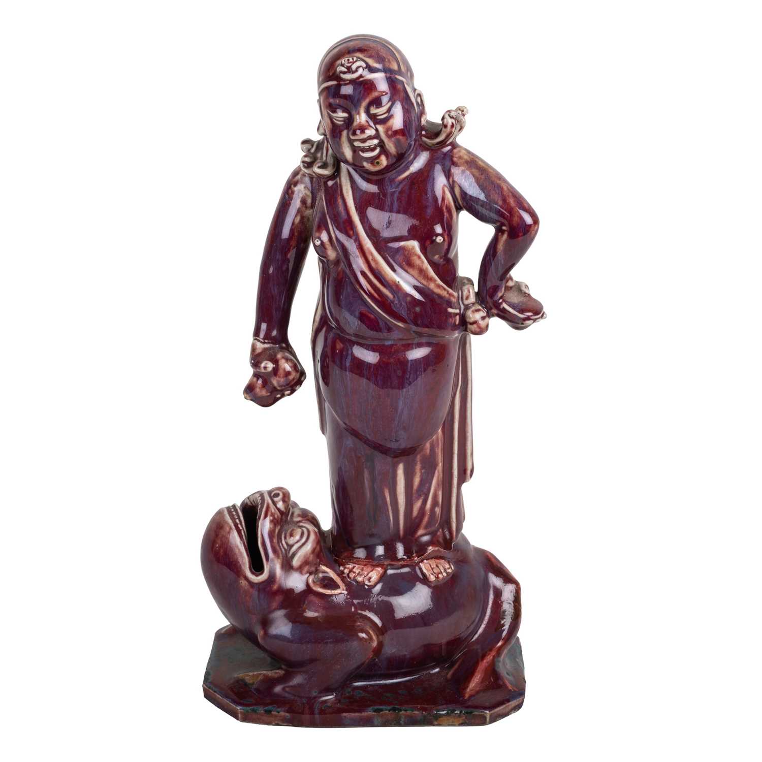Lot 237 - Sang de boeuf model of a figure on a toad...