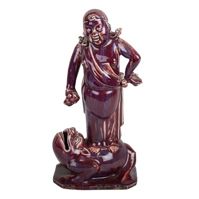 Lot 237 - Sang de boeuf model of a figure on a toad...