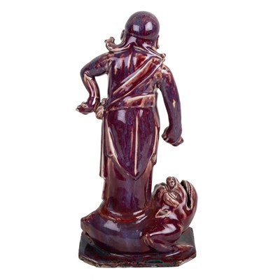 Lot 237 - Sang de boeuf model of a figure on a toad...
