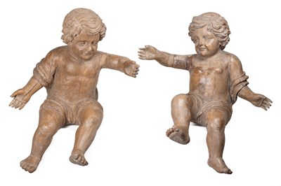 Lot 1168 - A pair of large carved wooden putti