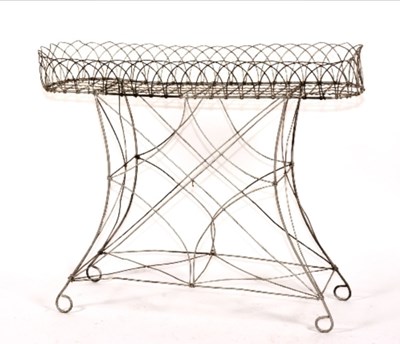 Lot 1523 - An early 20th century wirework jardinière