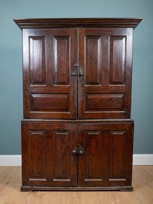 Lot 1031 - A George III stained pine housekeeper's cupboard
