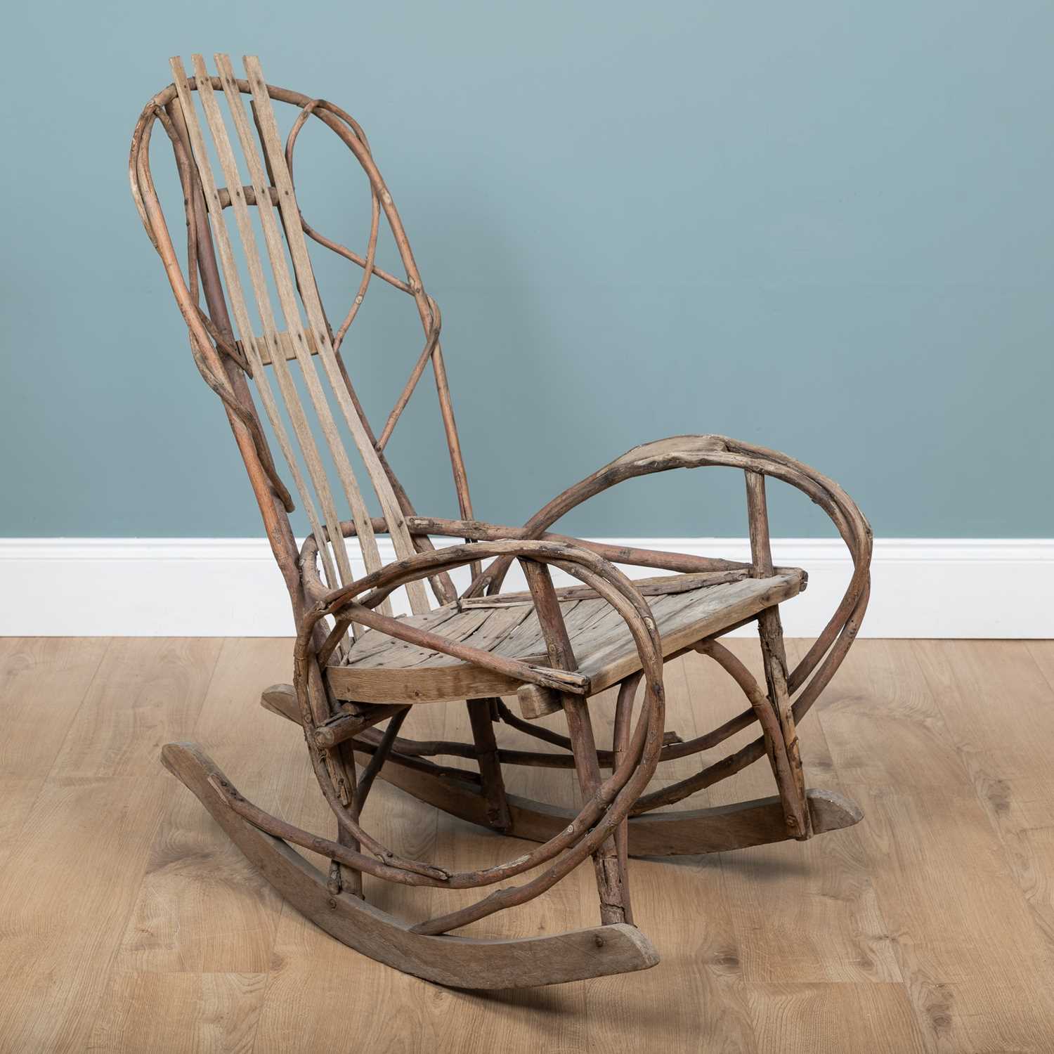 Lot 1223 - A 1940s American Folk Art steam-bent twigwork rocking chair