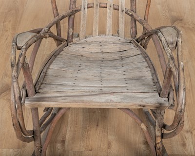 Lot 1223 - A 1940s American Folk Art steam-bent twigwork rocking chair