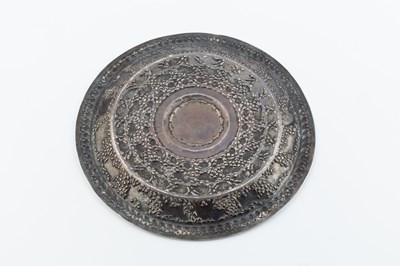 Lot 190 - An Indian silver circular plate, embossed and...