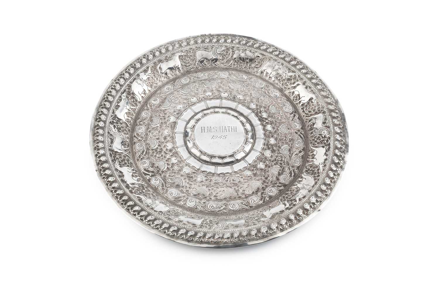 Lot 190 - An Indian silver circular plate, embossed and...