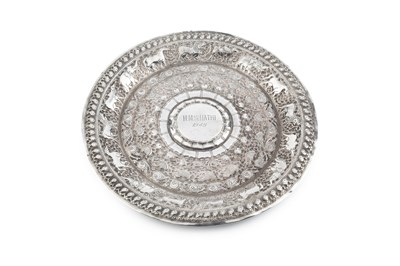 Lot An Indian silver circular plate, embossed and...
