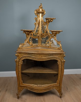 Lot 56 - A 19th century French gilt corner cabinet