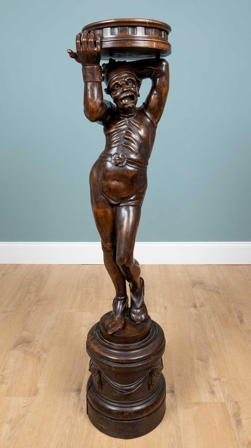 Lot 67 - A Continental figural carved wood torchère