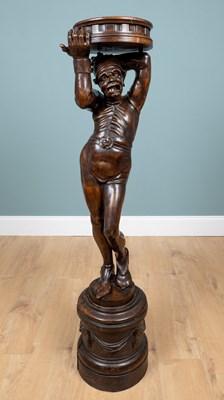Lot 67 - A Continental figural carved wood torchère