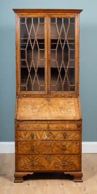 Lot 378 - A Georgian-style walnut bureau-bookcase
