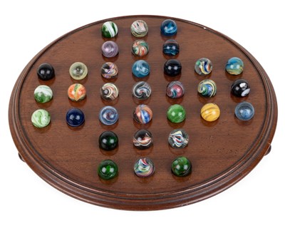 Lot 1127 - An Edwardian mahogany solitaire board