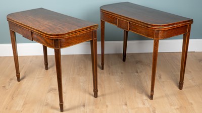 Lot 422 - A pair of George III mahogany fold-over tea tables