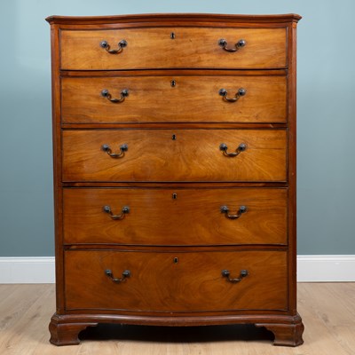 Lot A Victorian large serpentine chest of drawers
