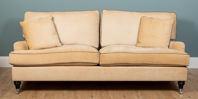 Lot 168 - A three-seater sofa in the style of George Smith