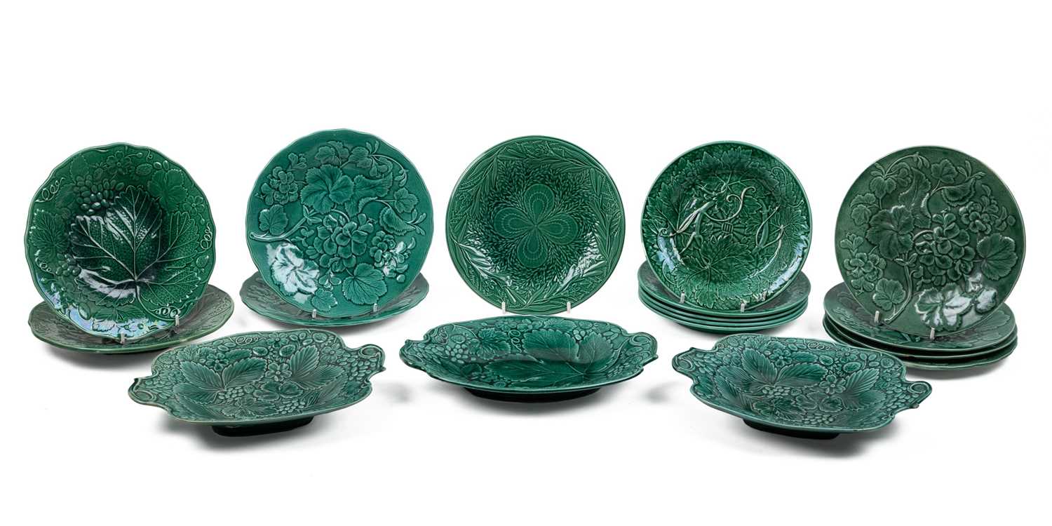 Lot 1134 - A collection of late 19th century leaf moulded green Majolica plates and dishes