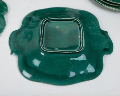 Lot 1134 - A collection of late 19th century leaf moulded green Majolica plates and dishes