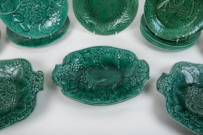 Lot 1134 - A collection of late 19th century leaf moulded green Majolica plates and dishes