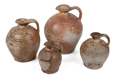 Lot 1122 - A group of four stoneware jugs