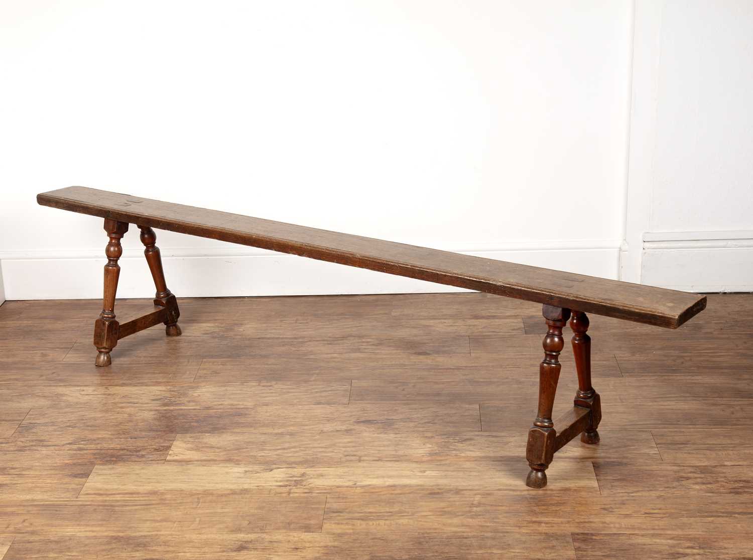 Lot 4 - Rustic oak school-type bench on twin turned...