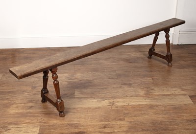 Lot 4 - Rustic oak school-type bench on twin turned...