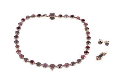 Lot 69 - A 19th century garnet collar necklace, the...