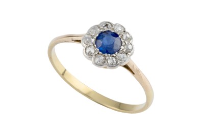 Lot 43 - A sapphire and diamond cluster ring, the...