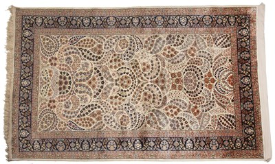 Lot 332 - An Indian kashmiri silk rug with foliate...