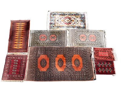 Lot 1257 - A collection of eight Afghan and Persian rugs
