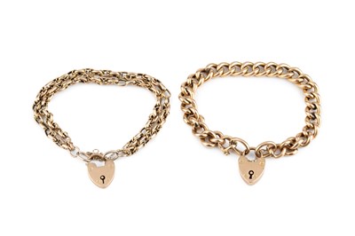 Lot 23 - A curb-link bracelet, stamped '9C', with 9ct...