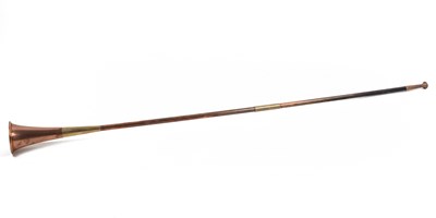 Lot 1183 - A copper and brass banding long hunting horn