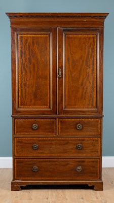 Lot 482 - A late Victorian or Edwardian mahogany linen press