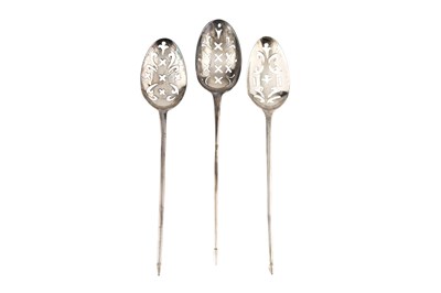 Lot 587 - Three 18th century silver mote spoons, each...