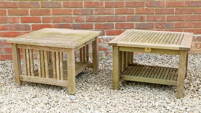 Lot 1429 - A pair of square teak garden tables