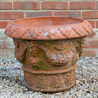 Lot 1358 - A Whichford pottery terracotta mask decorated planter