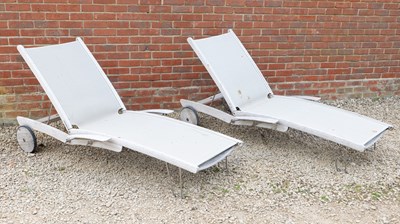Lot 1486 - A pair of Gloucester teak garden loungers