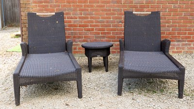 Lot 1340 - A pair of Gloster rattan-style reclining loungers